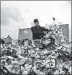  ?? OLGA MALTSEVA / AFP ?? From top: Unsold flowers are destroyed in St. Petersburg.