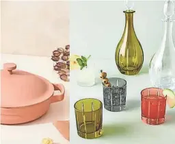  ?? OUR PLACE/ANTHROPOLO­GIE ?? Colored glassware, copper cookware, and handmade clay plates all make floating kitchen shelves look like works of art.