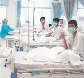  ?? THAILAND GOVERNMENT SPOKESMAN BUREAU VIA AP ?? Three of the 12 boys rescued from a Thailand cave are seen recovering in their hospital beds in a video image.