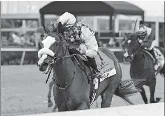  ?? DERBE GLASS/COGLIANESE PHOTOS, GULFSTREAM PARK/AP PHOTO ?? In this image provided by Gulfstream Park, Tiz the Law, ridden by Manuel Franco, wins the Florida Derby on Saturday at Gulfstream Park in Hallandale Beach, Fla.