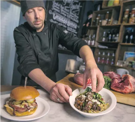  ?? PHOTOS: DAX MELMER/ WINDSOR STAR ?? Jim Renaud of The Willistead Restaurant garnishes a plate of braised beef cheek with Dijon-infused spatzle.