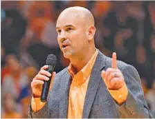  ?? THE ASSOCIATED PRESS ?? Jeremy Pruitt speaks before Tennessee’s men’s basketball game against Kentucky last Saturday night at Thompson-Boling Arena in Knoxville. Pruitt is settling in as the Vols’ new football coach after spending the past month splitting time in that role...