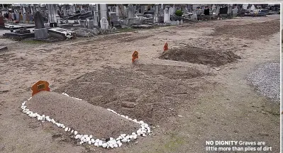  ?? ?? NO DIGNITY Graves are little more than piles of dirt