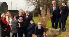  ??  ?? Acting principal Eva Clifford (far left), teacher Ruth Thorpe and pupils of Kilnamanag­h NS giving members of the WWETB a tour of the school’s sensory garden.