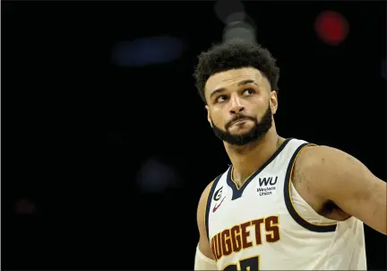  ?? AARON ONTIVEROZ — THE DENVER POST ?? Jamal Murray leads the Nuggets against the Suns during the third quarter at Footprint Center in Phoenix on Thursday.