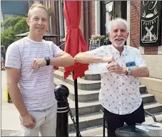  ?? Special to The Herald ?? Downtown business owner Mike Schyrbiak presents Penticton Mayor John Vassilaki with a cheque for $5,000 that will be used for proactive community policing.