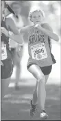  ?? NWA Democrat-Gazette/ANDY SHUPE ?? Rogers Heritage freshman Hailey Day (right) passes Benton senior Gracie Hyde on her way to a 27th-place finish Saturday in Fayettevil­le.