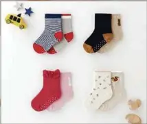  ??  ?? The socks have anti-slip rubber dots as well as a white space inside to write the child’s name.