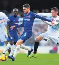  ??  ?? Tough scrap: Chelsea’s Jorginho battles for the ball with Everton’s Gylfi Sigurdsson