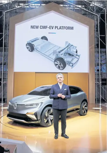  ?? REUTERS ?? Luca de Meo, CEO of Renault SA, stands in front of a Megane eVision as he speaks during a news conference about the company’s electric strategy during Renault eWays event in Meudon, France on Oct 15.