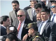  ?? AFP ?? Afghan Vice President Abdul Rashid Dostum, second from right, arrives at Hamid Karzai Internatio­nal Airport.