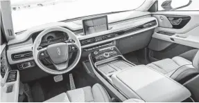  ??  ?? The Aviator theme carries into the interior and includes wireless charging.