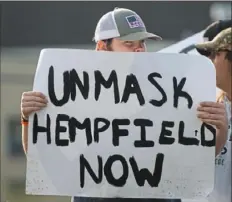  ?? Pam Panchak/Post-Gazette ?? A student protests the statewide masking policy in front of Hempfield Area High School in Greensburg.