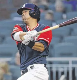  ?? JOHN BAZEMORE / ASSOCIATED PRESS ?? Braves catcher Kurt Suzuki’s 15th home run, lofted against the Rockies in Friday night’s 5‑2 win at SunTrust Park, gets himwithin one of setting a newcareer high in his fifirst seasonwith Atlanta.