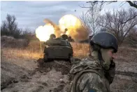  ?? ?? A Ukrainian self-propelled artillery vehicle fires on the frontline, Donetsk region, Ukraine, on Thursday. (AP Photo/ Iryna Rybakova)