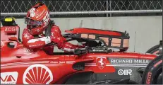  ?? (AP/Nick Didlick) ?? Ferrari driver Carlos Sainz Jr. of Spain climbs from damaged car during practice Thursday night at the Las Vegas Grand Prix. Sainz ran over a water valve cover on the temporary street course.