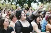  ?? WILLIE J. ALLEN JR./ORLANDO SENTINEL ?? Madi Green and the crowd cheer on the University Theatre Troupe as they sing songs from the play “Hamilton” and the movie “In The Heights” during the MadSoul Music & Arts Festival at Loch Haven Park in Orlando on Saturday.