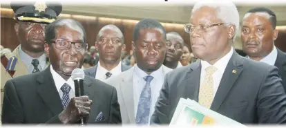  ??  ?? Zanu PF First Secretary President Mugabe addresses party workers after they presesnted a belated birthday gift at a Central Committee meeting held at the party’s national headquarte­rs in Harare yesterday. Looking on is party Secretary for...