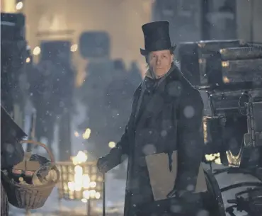  ??  ?? 0 Ebeneezer Scrooge (Guy Pearce) is obscure in word and deed in the new version of A Christmas Carol