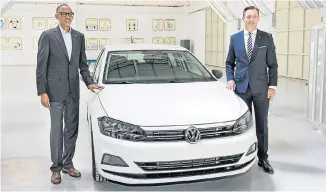  ??  ?? GETTING STARTED: Rwandan President Paul Kagame and VWSA chief executive Thomas Schaefer with the first VW to be assembled at the new plant in Kigali