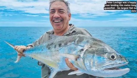  ?? ?? Peter Levinge was a happy man landing this meter-long queenfish - his largest fish to date