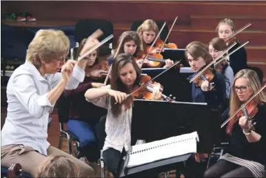  ??  ?? Caroline Hobbs-Smith rehearsing with Kent County Youth Orchestra