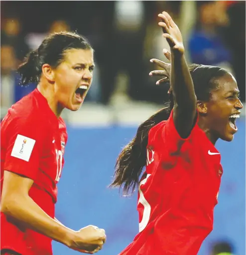  ?? Denis Balibouse / REUTERS ?? Canada’s Christine Sinclair celebrates a goal with teammate Nichelle Prince during the Women’s World Cup,
where the national team lost in the second round.