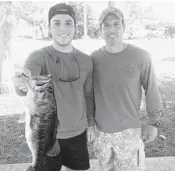  ?? EVERGLADES BASSMASTER­S/COURTESY ?? Conner D’Orio shows the bass he caught fishing with his father, Joe, to win the One Largemouth Bass Tournament.