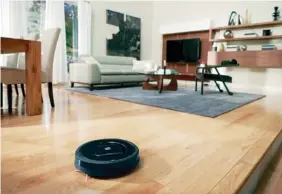  ?? THE NEW YORK TIMES ?? The newest Roomba, the 880, has the same hockey-puck profile of the earliest models. It not only cleans floors as well as an upright or canister vacuum cleaner, it may actually do a superior job on pet hair.