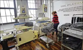  ?? ELISE AMENDOLA / AP ?? A worker presses garments at 99Degrees Custom last month in Lawrence, Mass. According to the Commerce Department, the U.S. economy turned in its weakest performanc­e in three years in the January-March quarter — the gross domestic product grew by just...