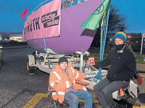  ?? Picture: PA. ?? Extinction Rebellion Scotland blocking the entrance with its big purple boat.