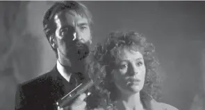  ?? ?? Alan Rickman and Bonnie Bedelia in a scene from 1988’s “Die Hard.”
