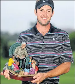  ??  ?? Scott with the unique Nelson Mandela Championsh­ip trophy he secured in 2013