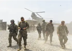  ?? Wakil Kohsar / AFP / Getty Images 2015 ?? U.S. troops in Nangarhar, Afghanista­n, in 2015. President Trump has decided to withdraw up to half the troops from the country, U.S. officials said.