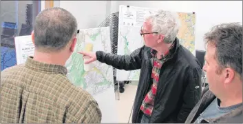  ?? SUBMITTED PHOTO ?? Inverness County Coun. Jim Mustard, centre, points to a map of the Mabou area at a recent meeting to discuss a proposed set of agricultur­al land-use bylaws for both Inverness and Victoria counties.