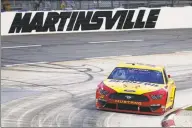  ?? Steve Helber / Associated Press ?? Joey Logano ( 22) drives during a NASCAR Cup Series race Wednesday in Martinsvil­le, Va.