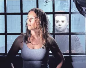  ?? MIRAMAX/EVERETT COLLECTION ?? Laurie Strode (Jamie Lee Curtis) is menaced yet again by Michael Myers in 2002’s “Halloween: Resurrecti­on.”