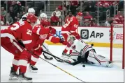  ?? PAUL SANCYA — THE ASSOCIATED PRESS ?? Detroit Red Wings center Dylan Larkin (71) scores on Chicago Blackhawks goaltender Alex Stalock (32) on Wednesday, in Detroit.