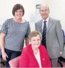  ??  ?? > Patient Joyce Thomas, seated, with her daughter Julie Morgan and consultant physician Dr Geraint Jeremiah