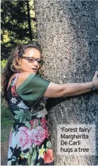  ??  ?? ‘Forest fairy’ Margherita De Carli hugs a tree