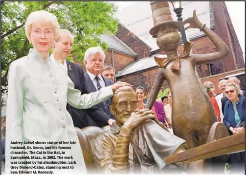  ??  ?? Audrey Geisel shows statue of her late husband, Dr. Seuss, and his famous character, The Cat in the Hat, in Springfiel­d, Mass., in 2002. The work was created by his stepdaught­er, Lark Grey Dimond-Cates, standing next to Sen. Edward M. Kennedy.