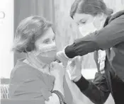  ?? JOE BURBANK/ORLANDO SENTINEL ?? Seminole County resident Gloria Calderone receives the Moderna vaccine at Orlando Health South Seminole Hospital in Longwood on Monday.