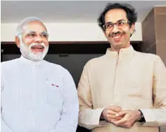  ?? PHOTO: PTI ?? SENSE OF TOGETHERNE­SS? Prime Minister Narendra Modi ( left) with Shiv Sena President Uddhav Thackeray