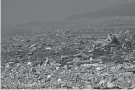  ?? EYLUL YASAR/AFP VIA GETTY IMAGES ?? Debris from collapsed buildings litters a hill in Kahramanma­ras, Turkey. The government says about 2 million survivors have been housed in temporary accommodat­ion or evacuated since the Feb. 6 earthquake.