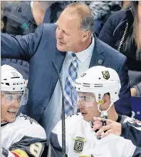  ?? AP PHOTO ?? In this 2017 file photo, Vegas Golden Knights coach Gerard Gallant stands behind the bench, behind center Jonathan Marchessau­lt (81) and right wing Reilly Smith (19) during the third period of an NHL hockey game against the Dallas Stars in Dallas.