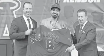  ??  ?? General manager Billy Eppler and owner Arte Moreno introduced All-Star infielder Anthony Rendon to Angels fans in December.