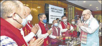  ?? PTI ?? Union home minister Amit Shah greets members from different groups of Assam in New Delhi on Saturday.