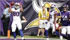  ?? BRUCE KLUCKHORN - THE ASSOCIATED PRESS ?? Buffalo Bills tight end Jason Croom (80) celebrates after catching a 26-yard touchdown pass during the first half of an NFL football game against the Minnesota Vikings, Sunday.