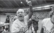  ?? GRIMSHAW — THE ASSOCIATED PRESS FILE ?? Los Angeles Dodgers manager Tom Lasorda celebrates after the Dodgers beat the Montreal Expos for the National League title in 1981. Lasorda has died at the age of 93.