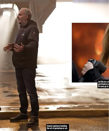  ??  ?? Francis Lawrence teaching the art of gesturing on set. Let this be a lesson: never get drunk at a tattoo party. Or even go to one. Ever.